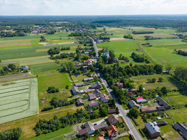 Aerial view of a small village in summer day. Concept of leave the village and desolate location - Foto, Bild