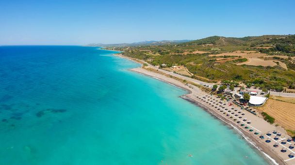 Aerial birds eye view drone photo beach on Rhodes island, Dodecanese, Greece. Panorama with nice lagoon and clear blue water. Famous tourist destination in South Europe - Photo, Image