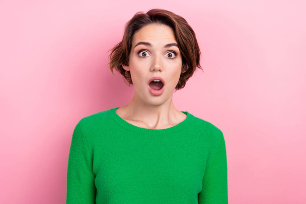 Portrait of young girlfriend wear green pullover open mouth speechless staring confused scared high price isolated on pink color background. - Foto, immagini