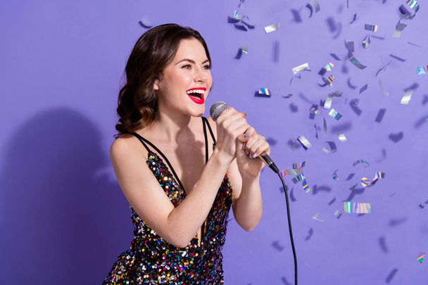 Photo of adorable shiny lady wear sequins dress smiling singing karaoke isolated purple color background. - Foto, Imagen