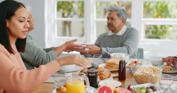 Breakfast, food and morning with big family at table for help, gratitude and wake up. Love, support and brunch with people eating in dining room at home for nutrition, wellness and health together. - Footage, Video