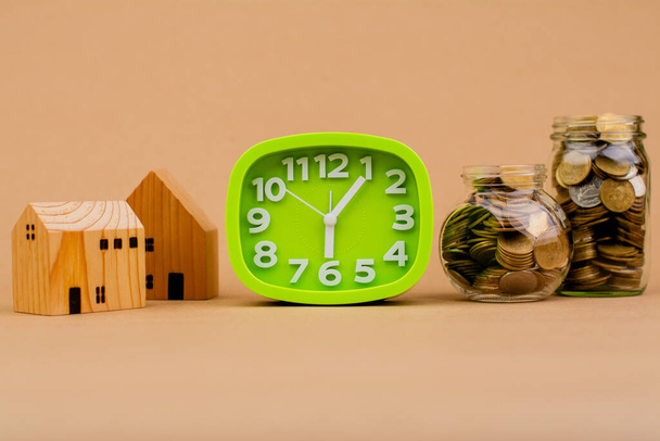 Saving coins in a glass jar Saving money for the future, investment savings, salary, income, expenditure, financial loan, home loan, loan, savings and financial growth concept. - Photo, Image