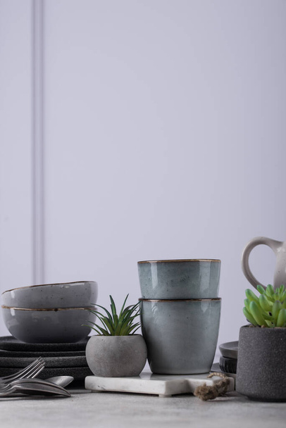 Handmade craft ceramic tableware, plates, bowls and cups. Scandinavian style - Zdjęcie, obraz