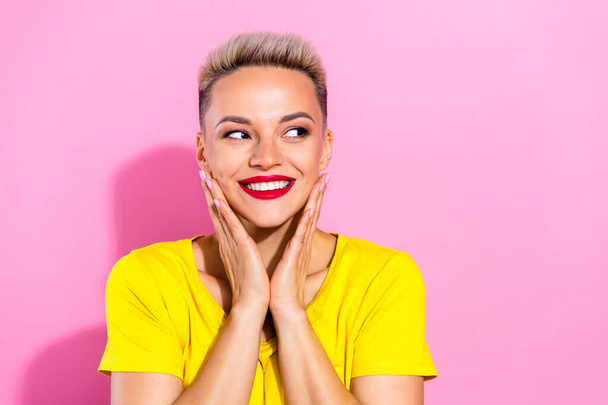 Portrait of lovely stunning positive girl arms touch cheekbones beaming smile look empty space isolated on pink color background. - Foto, Bild