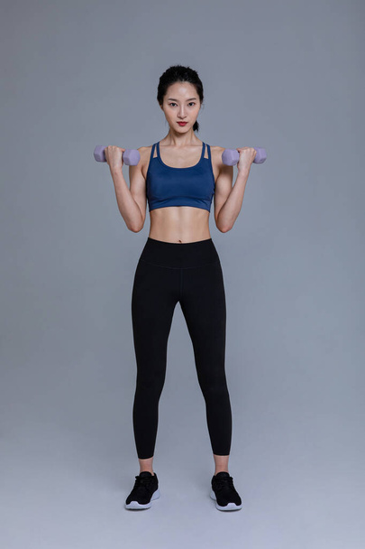 healthy beauty concept photo of korean asian beautiful woman with dumbbell - Fotoğraf, Görsel
