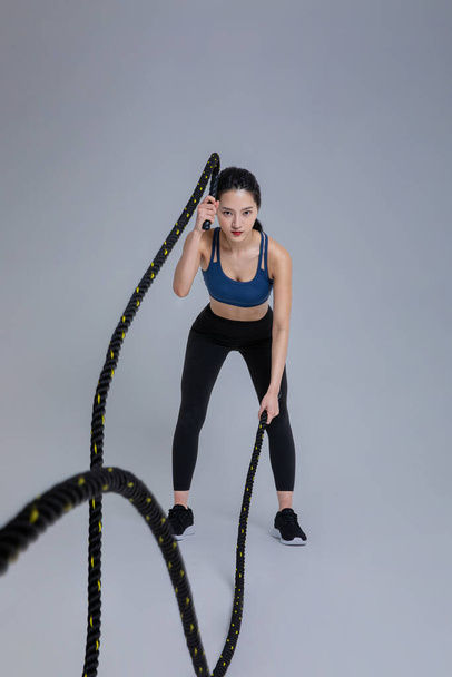 healthy beauty concept photo of korean asian beautiful woman with battling ropes - Foto, afbeelding