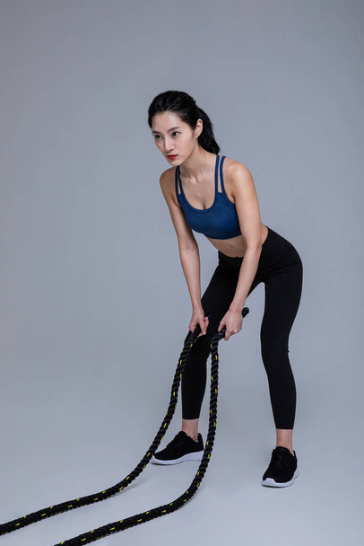 healthy beauty concept photo of korean asian beautiful woman with battling ropes - Zdjęcie, obraz