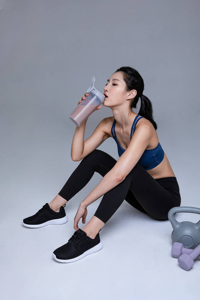 healthy beauty concept photo of korean asian beautiful woman with protein shakes - Фото, зображення