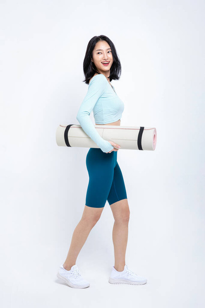 healthy beauty concept photo of korean asian beautiful woman with yoga mat - Photo, Image