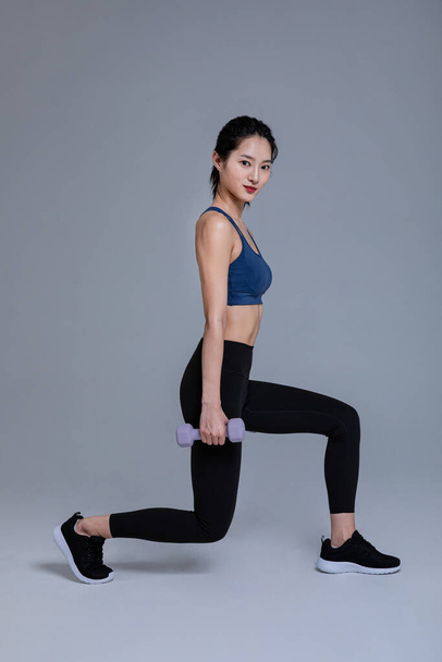 healthy beauty concept photo of korean asian beautiful woman with dumbbell - Foto, immagini