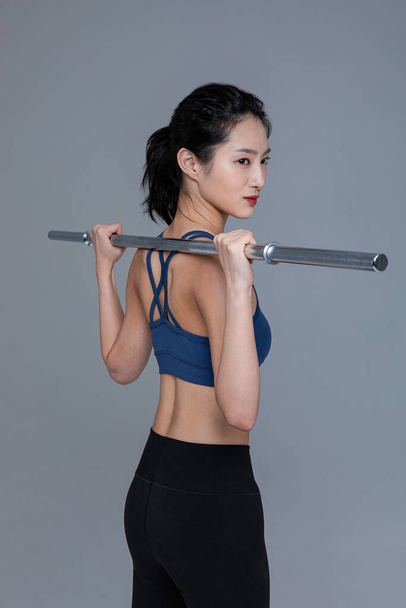 healthy beauty concept photo of korean asian beautiful woman with barbell - Foto, immagini