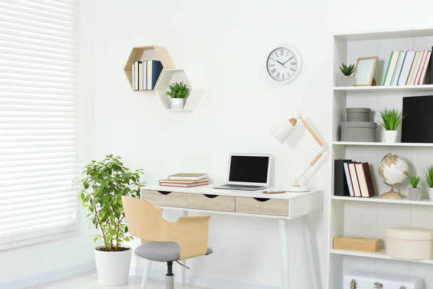 Beautiful workplace with comfortable desk and chair at home - Foto, immagini