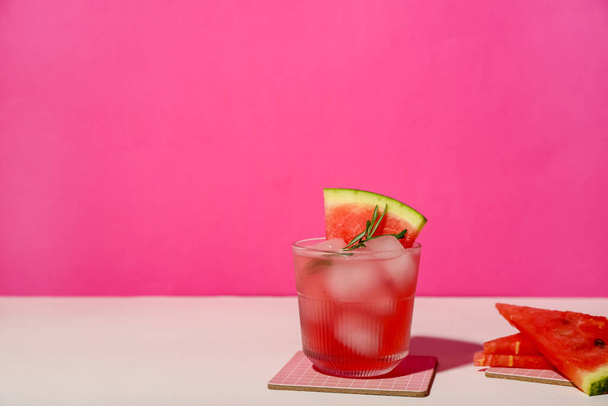 Glass of tasty watermelon cocktail on color background - Photo, Image