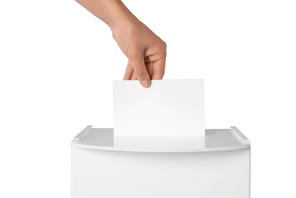 Man putting his vote into ballot box on white background, closeup - Valokuva, kuva