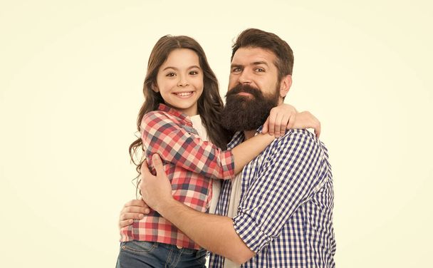 The first true love a girl has is her dad. Happy dad and adorable little daughter hugging and smiling. Bearded dad and small girl child wearing casual hipster style fashion. My dad is my love. - Foto, imagen