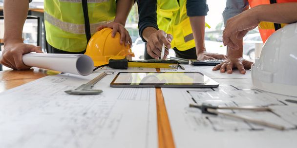 engineer team working in office with blueprints, inspection in workplace for architectural plan, construction project ,Business construction. - Photo, Image