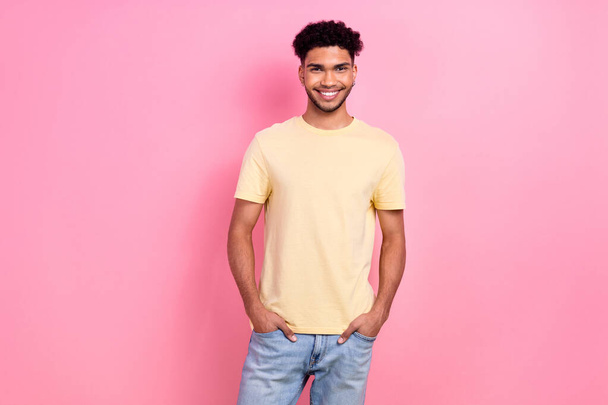 Photo portrait of funny young handsome guy posing camera shopping model wear shirt denim pants isolated pink color background. - Foto, Bild
