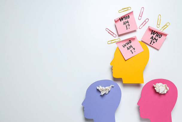Colorful paper heads, notes with text on white background, space for text - Photo, Image