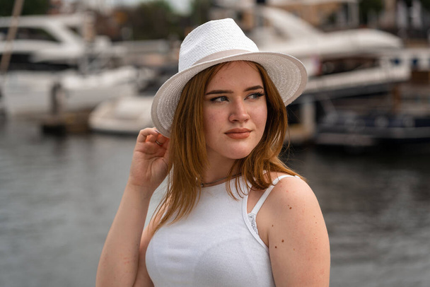 girl in a white hat on the background of the city of Gdansk Poland Europe - Foto, imagen