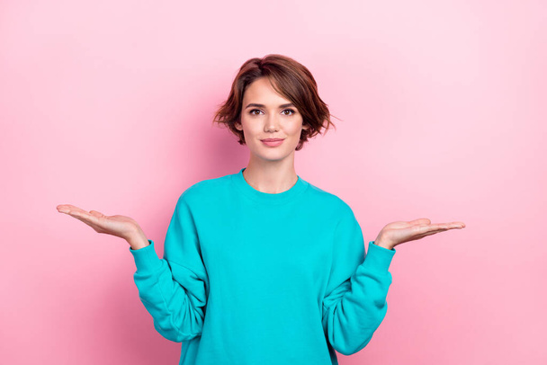 Portrait of candid lovely girl wear trendy teal clothes two palms hold novelty presenting seasonal sale isolated on pink color background. - Foto, afbeelding