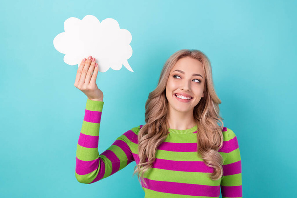 Portrait of adorable gorgeous toothy beaming girl wear stylish clothes look at mind cloud in hand isolated on blue color background. - Foto, Bild