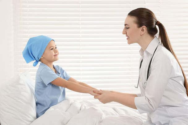 Childhood cancer. Doctor and little patient in hospital - Фото, изображение