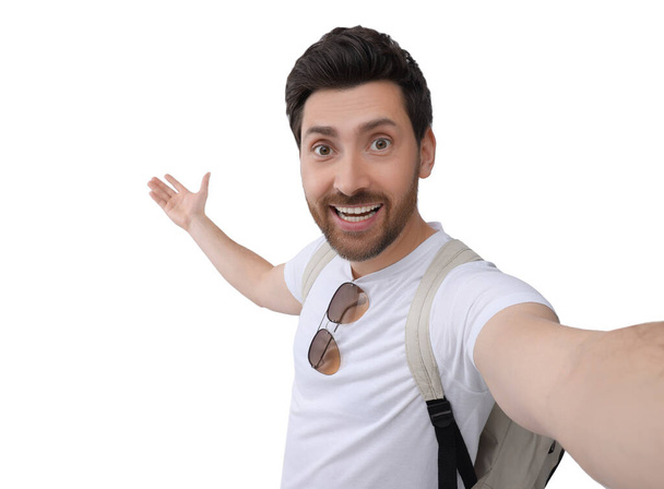 Smiling man taking selfie on white background - Fotoğraf, Görsel