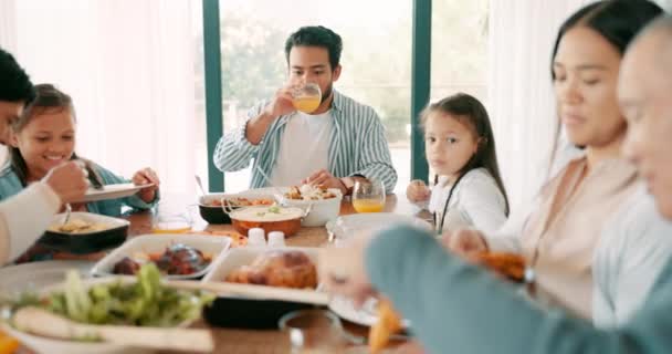 Kids, parents and grandparents at thanksgiving together as a family eating food for bonding in celebration. Love, lunch or brunch with children and relatives at the dining room table during a holiday. - 映像、動画