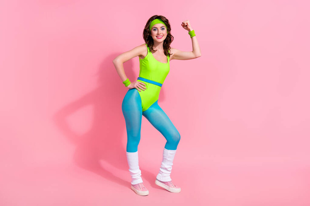 Photo of power coach sporty lady have sport routine show triceps muscular body isolated over pastel color background. - Fotografie, Obrázek