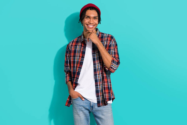 Photo portrait of nice young guy touch chin thoughtful toothy smile wear trendy plaid clothes isolated on aquamarine color background. - Foto, Imagem