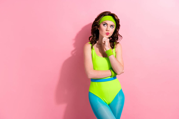 Photo of serious puzzled sportive lady think solution what sport club choose isolated on pastel color background. - Foto, Imagen