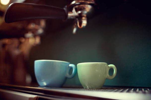 detail of making coffee. close up of two cups. blue and green - Valokuva, kuva