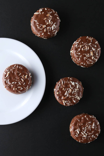 Chocolate cookies with coconut shaving chocolate coating and coconut - Fotografie, Obrázek