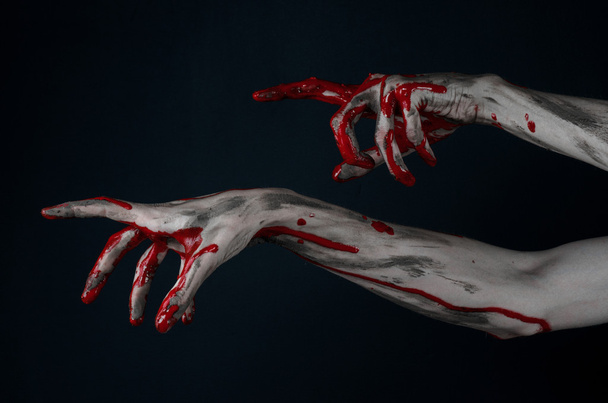 Bloody Halloween theme: horrible zombie demon bloody hands on a black background - Foto, Imagem