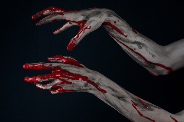 Bloody Halloween theme: horrible zombie demon bloody hands on a black background - Foto, afbeelding