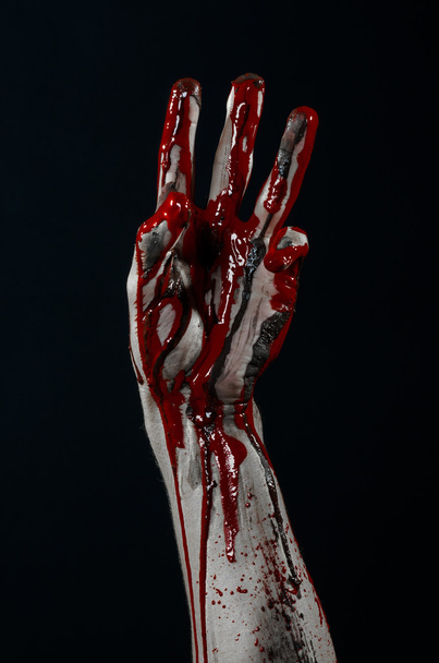 Bloody Halloween theme: horrible zombie demon bloody hands on a black background - Foto, imagen