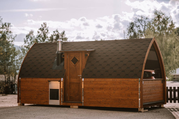Brown igloo sauna during sunny summer weather - Photo, Image