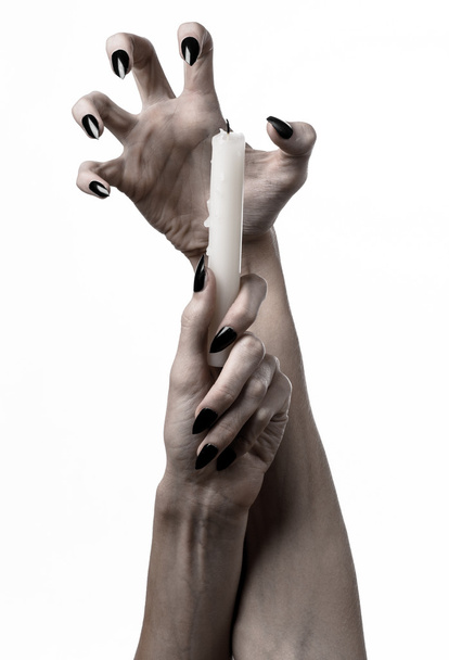 hands holding a candle, a candle is lit, white background, solitude, warmth, in the dark, Hands death, hands witch - Photo, image