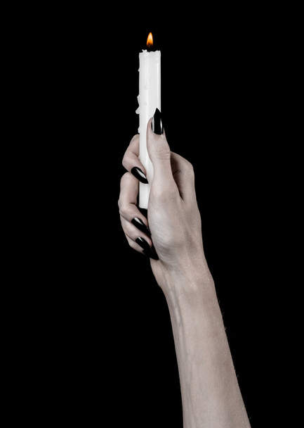 hands holding a candle, a candle is lit, black background, solitude, warmth, in the dark, Hands death, hands witch - Φωτογραφία, εικόνα