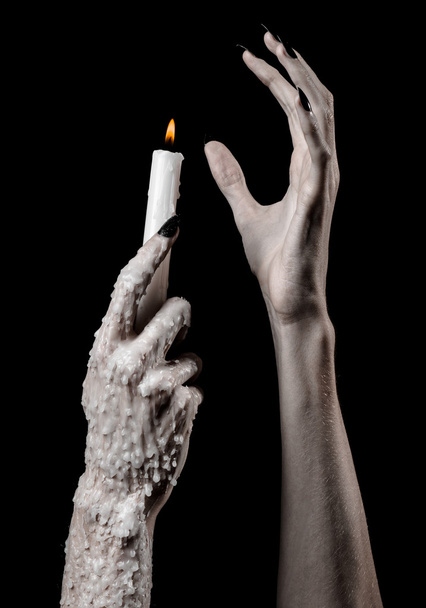 hands holding a candle, a candle is lit, black background, solitude, warmth, in the dark, Hands death, hands witch - Photo, image