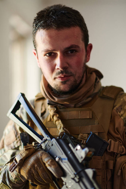 Modern warfare soldier portrait in urban environment.  - Fotó, kép
