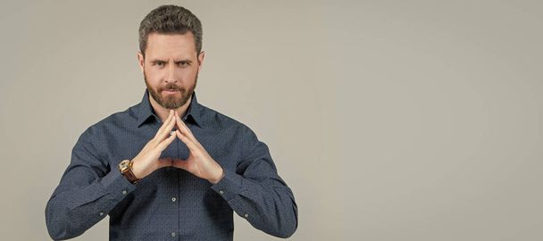 Unshaven man in business casual style show raised steeple hand gesture feeling confident, expert. Man face portrait, banner with copy space - Фото, зображення
