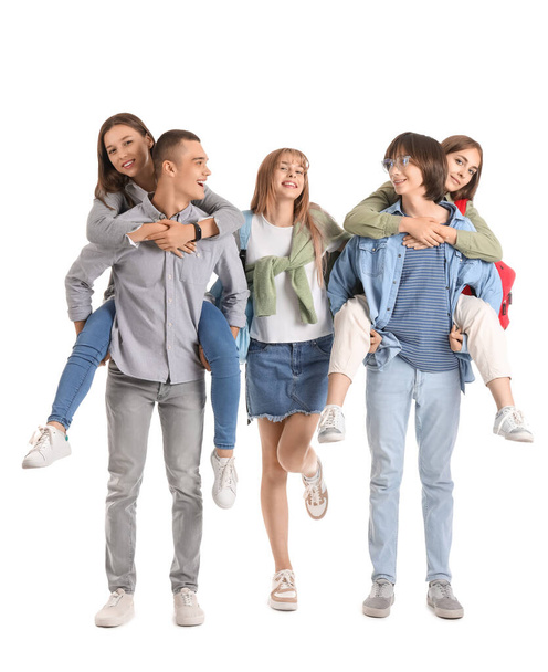 Group of teenage students on white background - Foto, Imagen