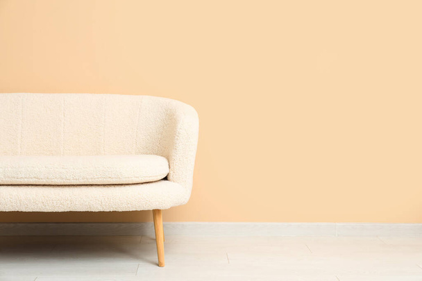 Cozy white sofa near beige wall - Φωτογραφία, εικόνα