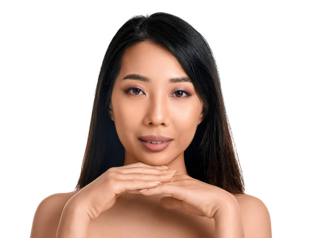 Beautiful young Asian woman with healthy skin on  white background - 写真・画像