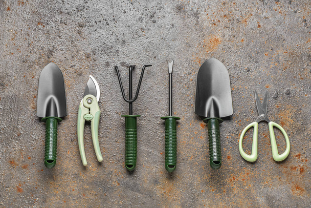 Set of gardening tools on grey grunge background - 写真・画像