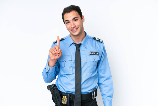 Fiatal rendőr kaukázusi férfi elszigetelt fehér háttér mutatja és emeli az ujját jele a legjobb - Fotó, kép