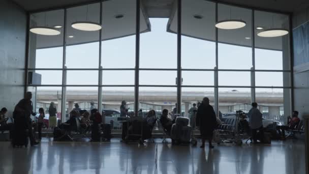 Paris, France - June 25, 2023. Passengers walking inside the terminal at charles de gaulle airport - Footage, Video