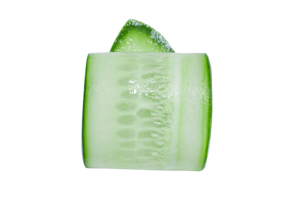 Thinly sliced twisted slice of fresh green cucumber on a white background. - Photo, Image