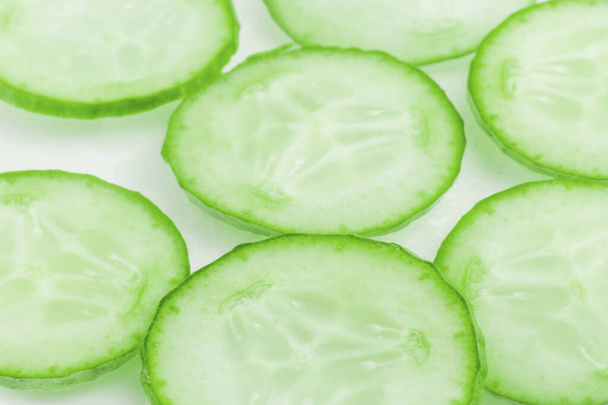 Thinly sliced slices of fresh green cucumber.  - Photo, Image